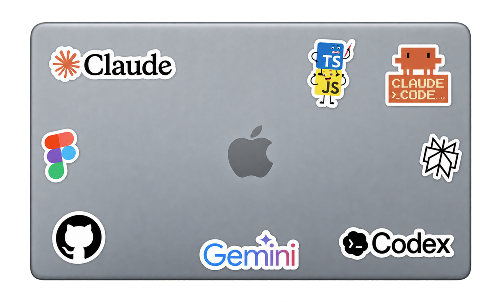 Silver laptop with small Claude, Claude Code, Figma, Perplexity, Gemini, Codex, GitHub and TypeScript/JavaScript stickers